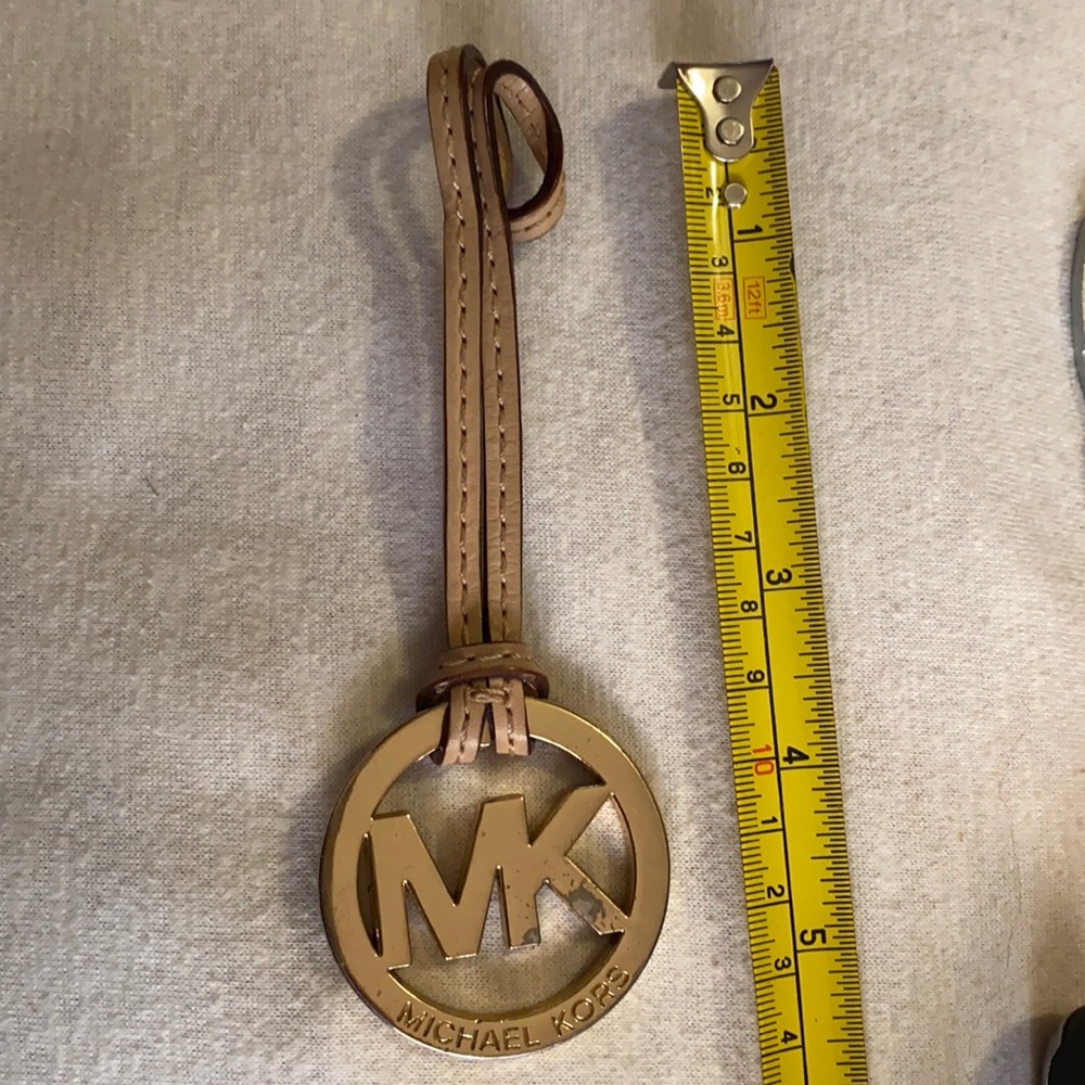 Michael Kors bag charm used,